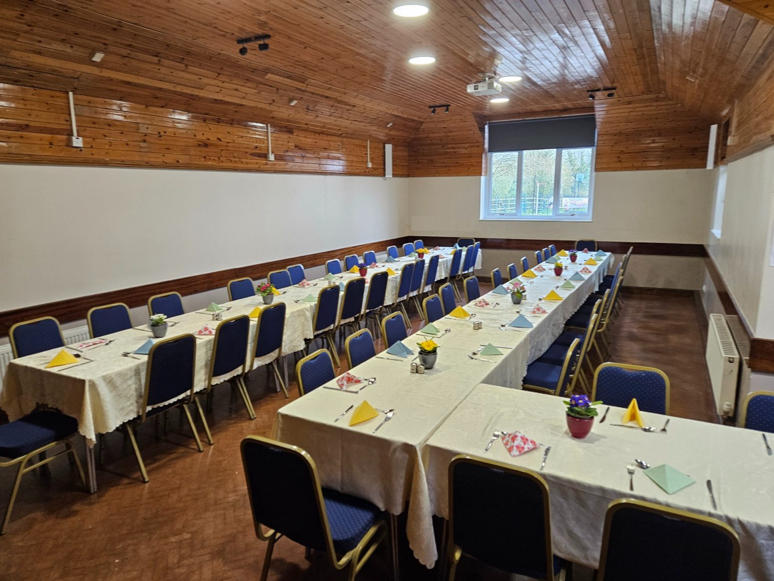 The hall laid out for a formal meal